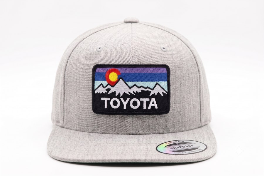 Grey snapback with a Colorado mountains Toyota patch on the front.